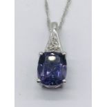 A 9ct white gold necklace and pendant set with an amethyst and diamonds