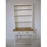 A contemporary white part painted dresser, with two drawers, length 98cm, height 202cm.