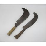 An antique steel billhook, marked 'Knappman & Son', together with another.