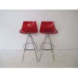 A pair of Italian Calligaris Ice designer bar stools.