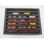 A collection of unboxed N Gauge USA freight rolling stock including wagons and tankers (17 in