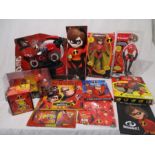 A collection of Disney Pixar Incredibles toys and merchandise including Stretching & Speeding