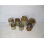A quantity of stoneware jars.