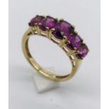 A garnet five stone ring set in 9ct gold