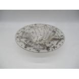 An art glass bowl by Isabel Merrick, decorated with figures, signed and dated 1986 on base.