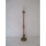 A gilded standard lamp.