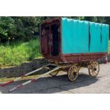 A vintage traditional square top "Gypsy" caravan with hand painted decoration- canvas covering in