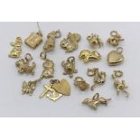 A collection of 9ct gold charms, total weight 23.9g