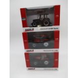 A collection of three boxed Universal Hobbies Case IH die-cast tractor models including two Maxxum