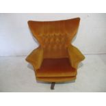 A mid century G-plan burnt orange Blofeld chair.