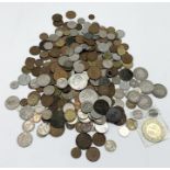 A collection of various UK and worldwide coinage including some silver