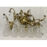 A large Victorian brass six branch chandelier along with a matching pair of two branch wall lights