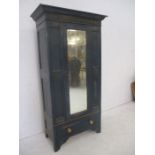 A painted oak wardrobe with mirror and Greek key pattern decoration.