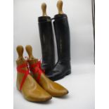 A pair of vintage leather riding boots (size 10) with trees, along with a pair of boot lasts.