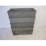 A collection of five rectangular galvanised stackable storage trays