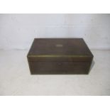 A brass bound rosewood writing slope, with campaign handles.