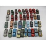 A collection of vintage Dinky play worn die-cast cars and vans including Ford Sedans, Trojan Vans,