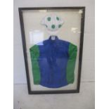 A framed set of horse racing colours/silks of the National Hunt owner the late David Johnson, signed