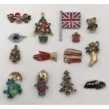 A collection of Butler & Wilson brooches including a number of Christmas themed pieces, frogs,