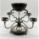 A silver plated centrepiece with four candle holders and turned wooden bowl - Height including