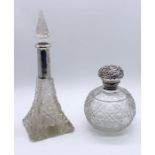 Two cut glass and hallmarked silver scent bottles- 1 missing stopper