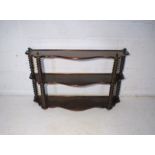 A Victorian mahogany wall hanging display shelf, with bobbin turned supports.