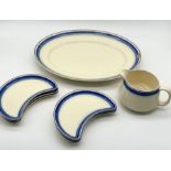 A small collection of Clarice Cliff Bizarre including six half moon dishes, a large serving