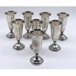 A set of 8 sterling silver Kiddush cups, stamped 'Randahl' and 'Sterling' to bases designed by Georg