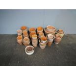 A quantity of terracotta garden pots.