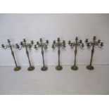 A set of six ecclesiastical brass candelabra's (five matching) - overall height 74cm