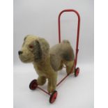 A child's Pedigree Soft Toys Ltd push-along dog