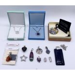 A collection of 925 silver pendants, some with 925 silver chains