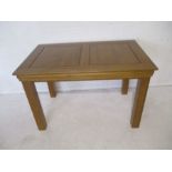 A modern oak dining table, length 120cm, height 76cm, depth 75cm.