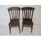 A pair of elm country chairs.