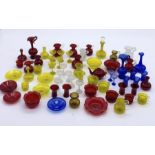 A collection of miniature coloured glassware including jugs, glasses etc