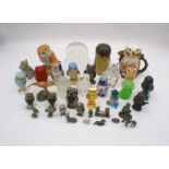 A collection of owl figures, along with a few other animals, some metal, glass and ceramic,