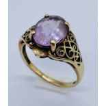 A 9ct gold amethyst ring with pierced decoration