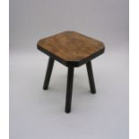 An oak four legged stool.