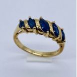 A sapphire 5 stone ring set in 9ct gold