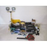 A selection of tools including a Titan tile cutter, an Earlax super sprayer, a Titan downlighter