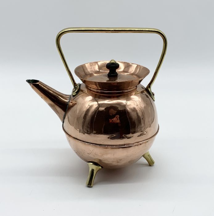 Dr Christopher Dresser for Benham and Froud, a copper and brass kettle with upturned rim, angular