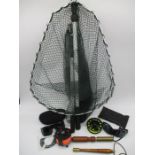 A small collection of fly fishing equipment including two priests, two reels including a Compo 69,