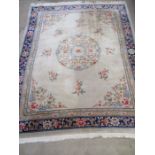 A large cream and blue Chinese style rug - overall approx. size 310cm x 240cm
