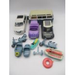 A collection of Lil Bratz toy vehicles including a campervan, limousine (missing door), spring break