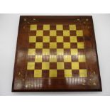 A modern wooden folding games board which includes a chess/checkers board and backgammon to inner