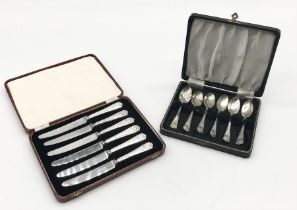 A cased set of hallmarked silver coffee spoons celebrating King George V silver jubilee along with a
