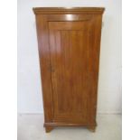 A Victorian scumble glazed single door wardrobe