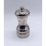 A hallmarked silver pepper grinder