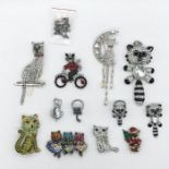 A collection of Butler & Wilson brooches and other jewellery in the form of cats and raccoons