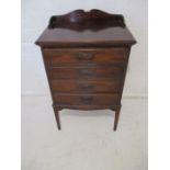 Edwardian mahogany music cabinet with four drawers.
